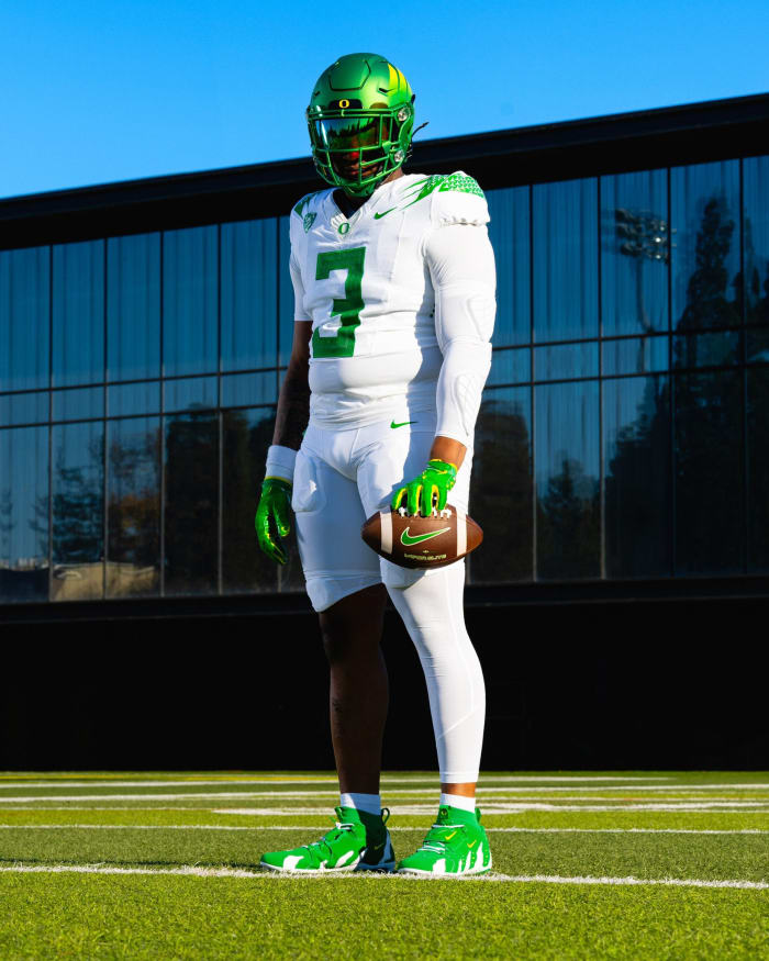 Oregon Ducks defensive lineman Brandon Dorlus models a uniform for the Pac-12 Championship against Washington.